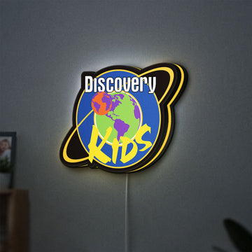 Discovery Kids Space LED lightbox hanging on a wall with yellow glow