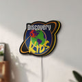 Unlit Discovery Kids Space LED lightbox mounted on a wall in daylight