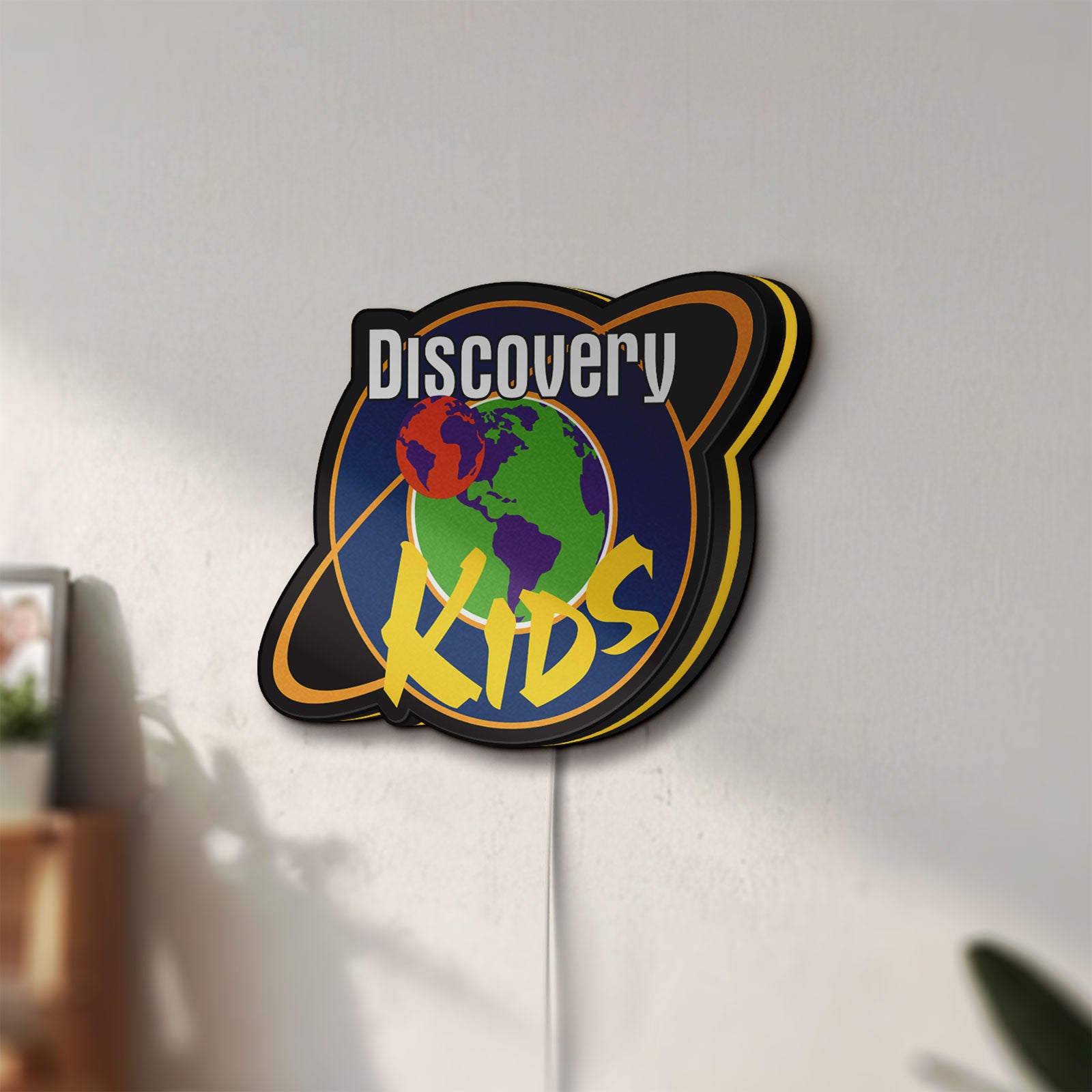 Unlit Discovery Kids Space LED lightbox mounted on a wall in daylight