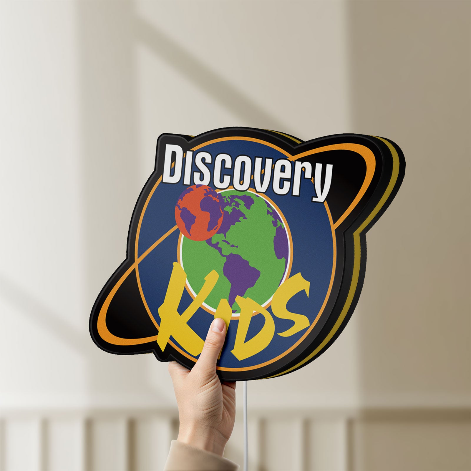 Unlit Discovery Kids Space LED lightbox held by hand to show size and details