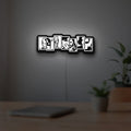 Avengers LED lightbox hanging on a room wall with soft white light