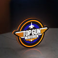 Top Gun Maverick LED lightbox standing on a desk from an angled side view with orange glow