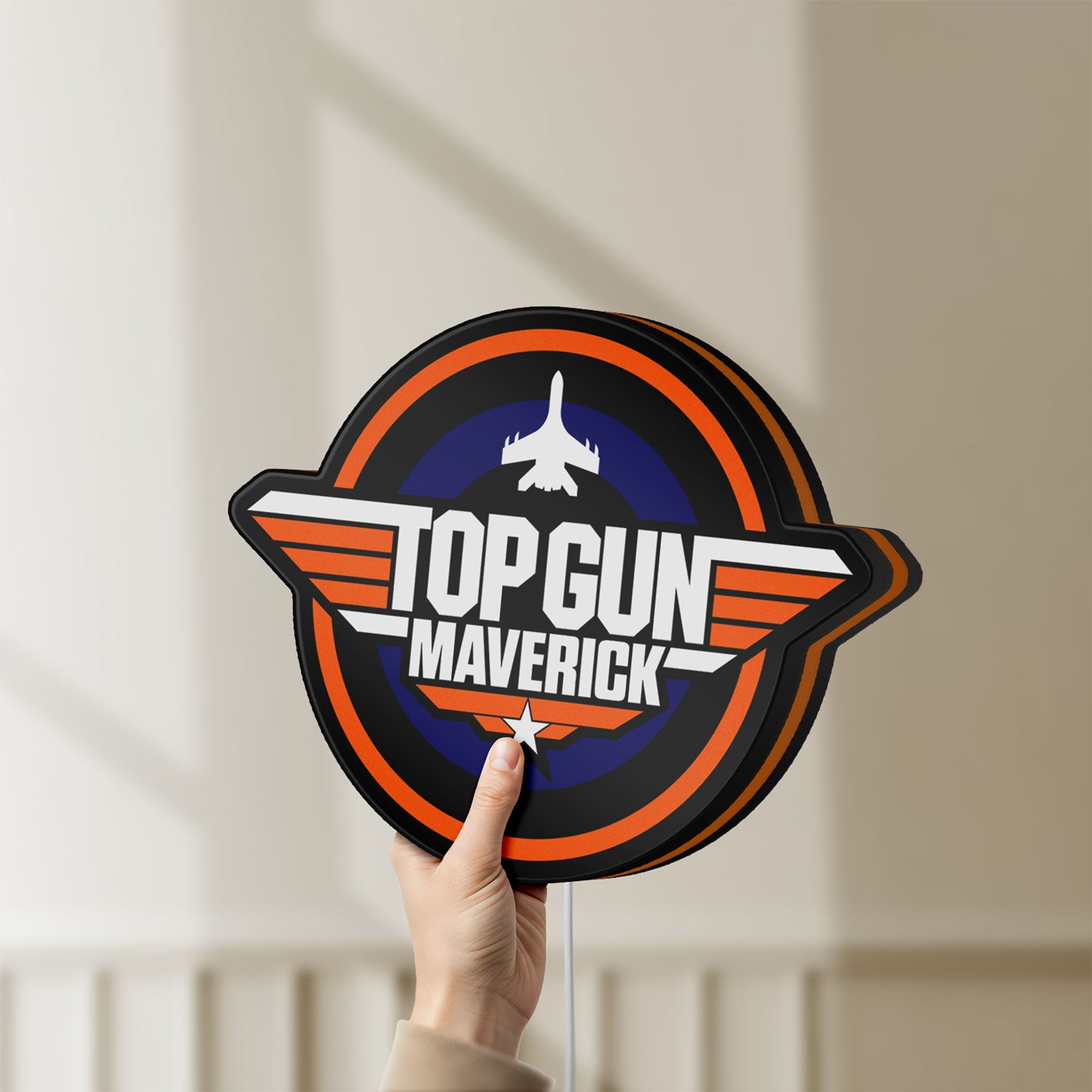 Unlit Top Gun Maverick LED lightbox held by hand to show size and details