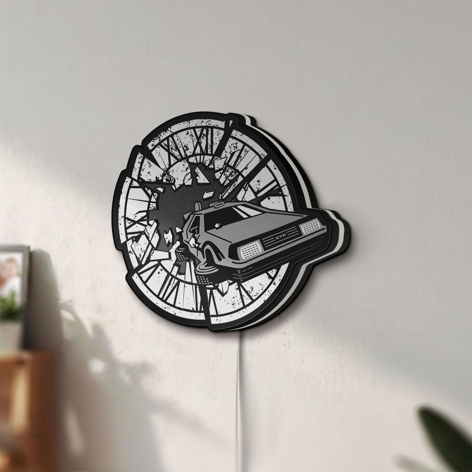 Unlit Back to the Future Delorean LED lightbox mounted on a wall in daylight