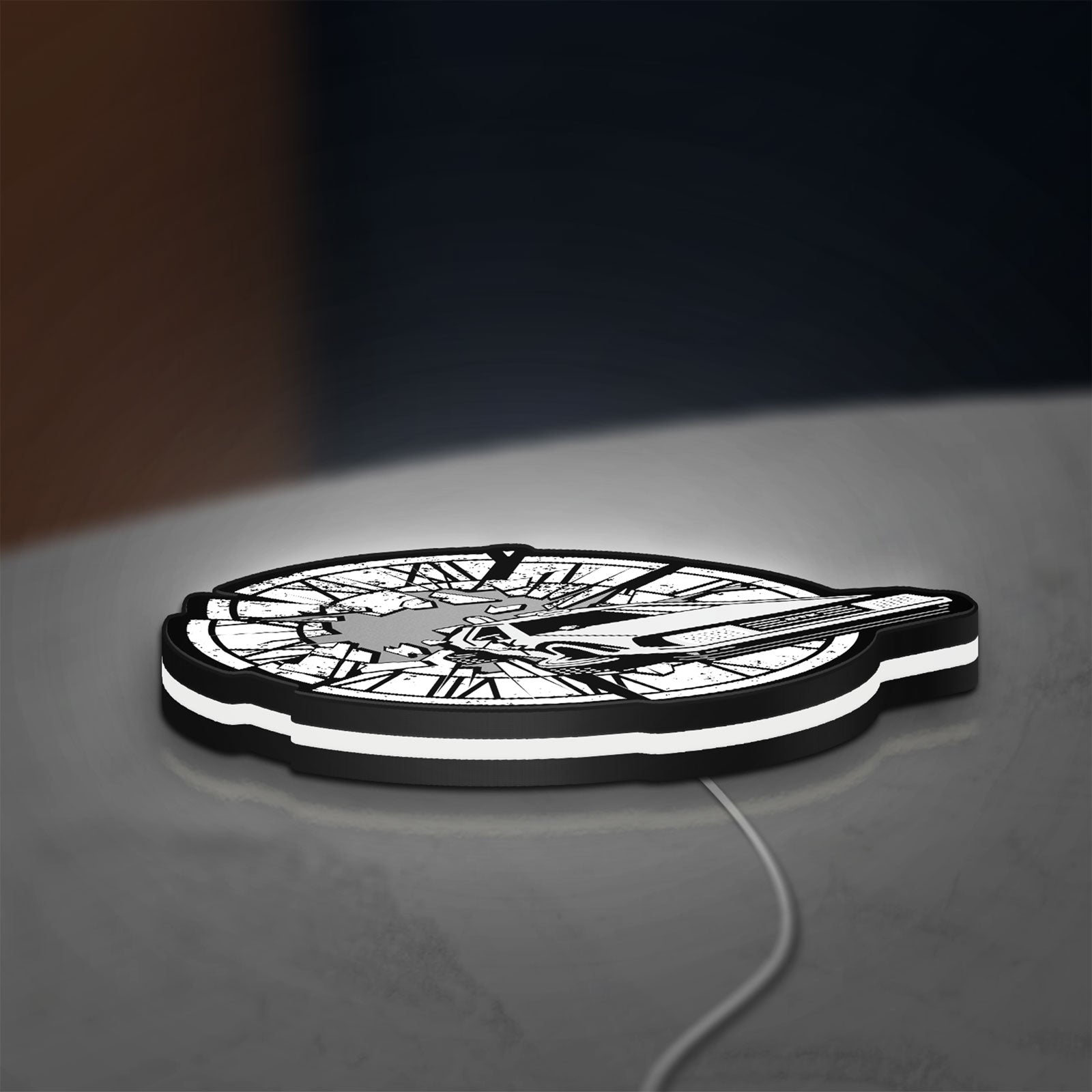 Back to the Future Delorean LED lightbox lying flat on a desk with white glow