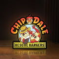 Front view of Chip n Dale Rescue Rangers LED lightbox sign glowing on a wooden desk