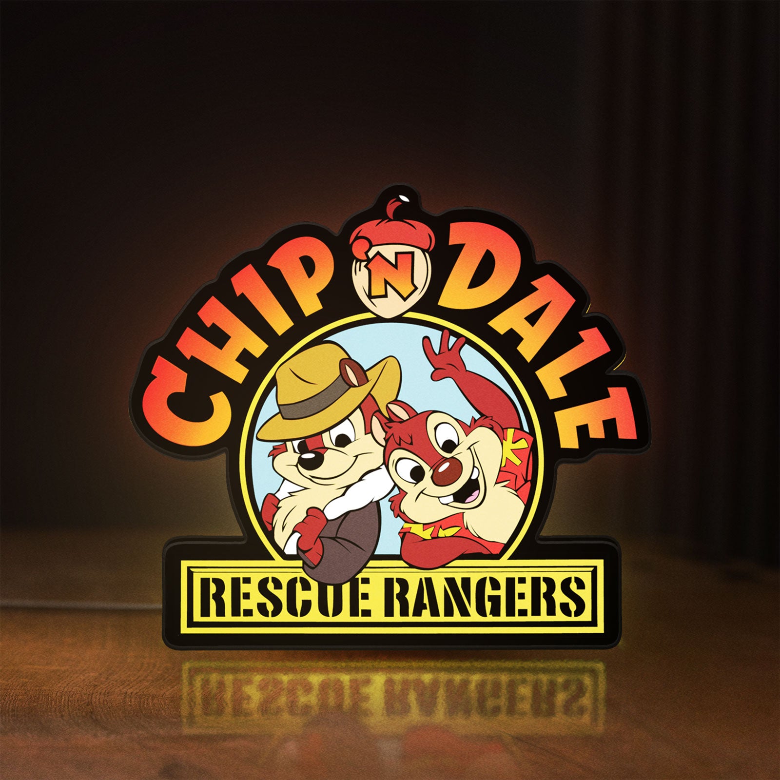 Front view of Chip n Dale Rescue Rangers LED lightbox sign glowing on a wooden desk