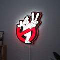 Ghostbusters LED lightbox hanging on a wall with red glow