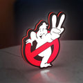 Ghostbusters LED lightbox standing on a desk from an angled side view with red glow