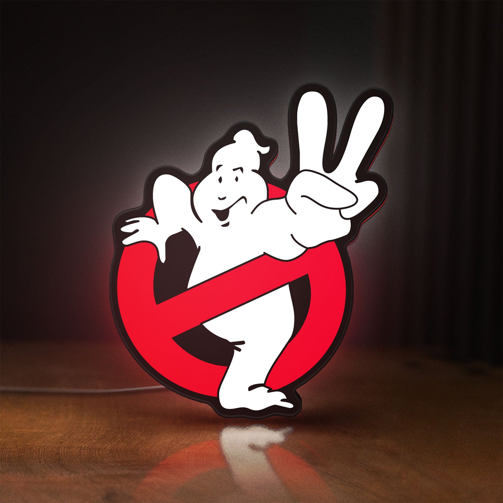 Front view of Ghostbusters LED lightbox sign glowing on a wooden desk