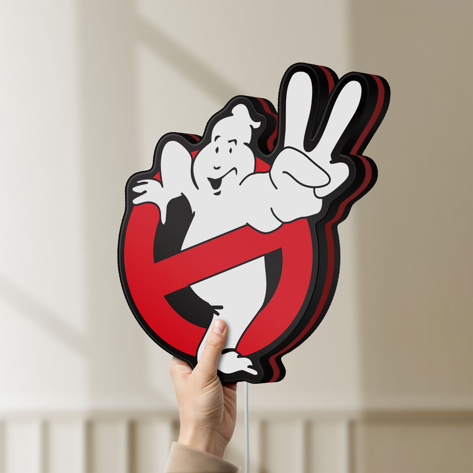 Unlit Ghostbusters LED lightbox held by hand to show size and details