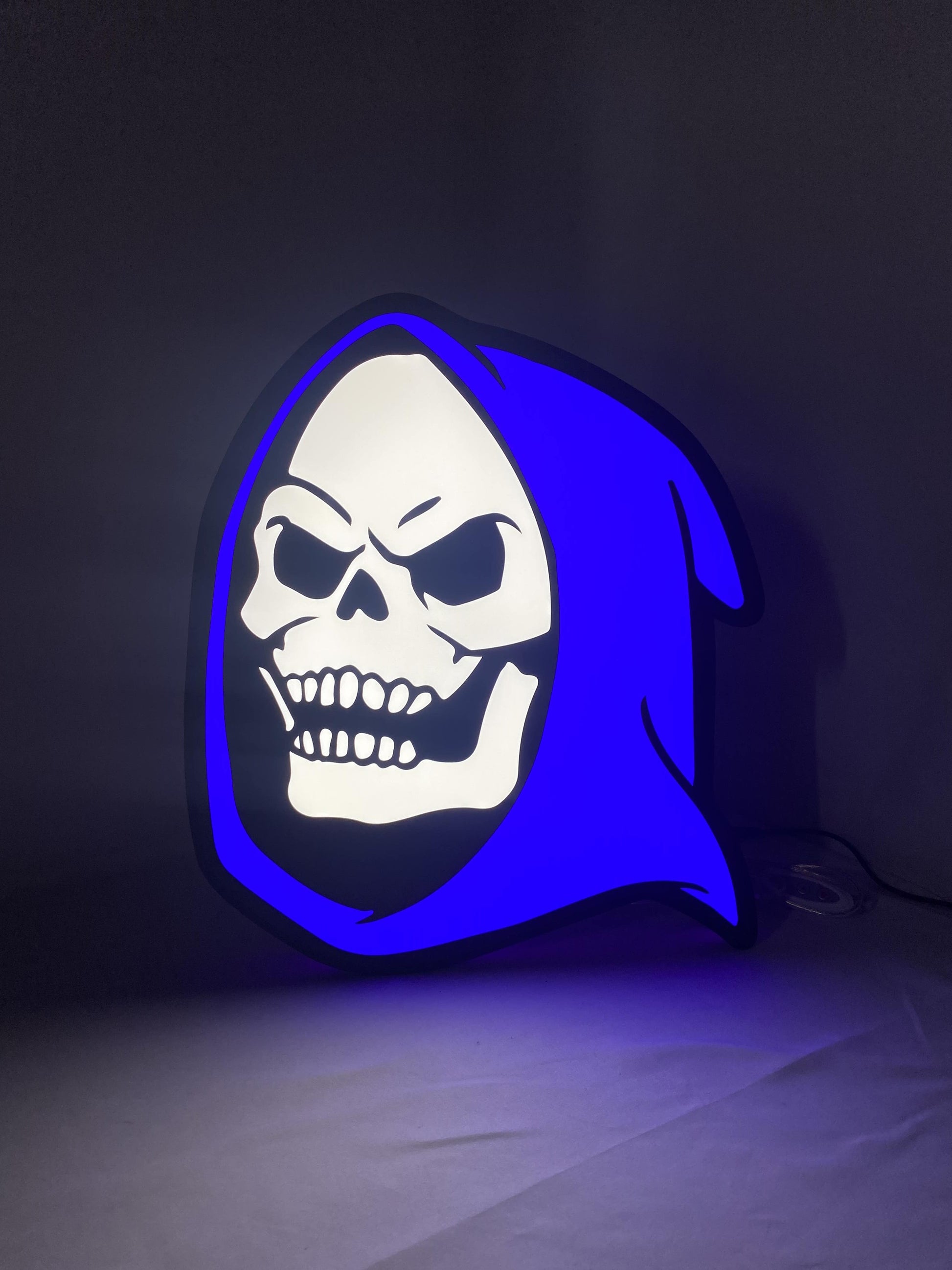 Illuminated front view standing of Skeletor 3D LED Sign in 40cm, unique wall art for desk and room decor