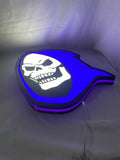 Illuminated flat lay angled view of Skeletor Illuminated Sign in 40cm, unique wall art for desk and room decor