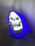 Illuminated handheld size reference of Skeletor 3D LED Sign in 40cm, unique wall art for desk and room decor