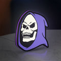 Skeletor LED lightbox standing on a desk from an angled side view with purple glow