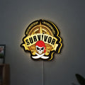 Expedition Robinson Survivor LED lightbox hanging on a wall with yellow glow