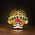 Front view of Expedition Robinson Survivor LED lightbox sign glowing on a wooden desk