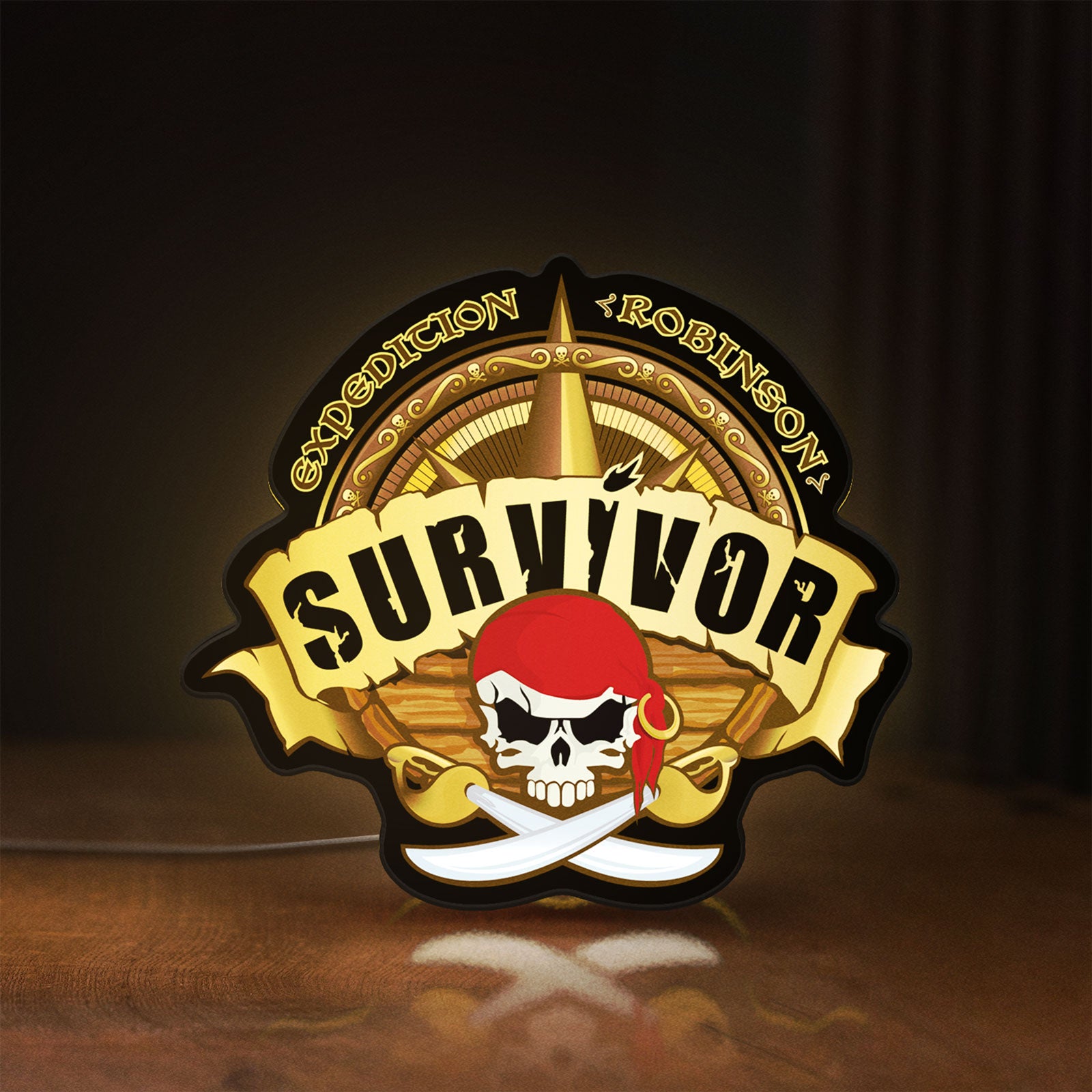 Front view of Expedition Robinson Survivor LED lightbox sign glowing on a wooden desk