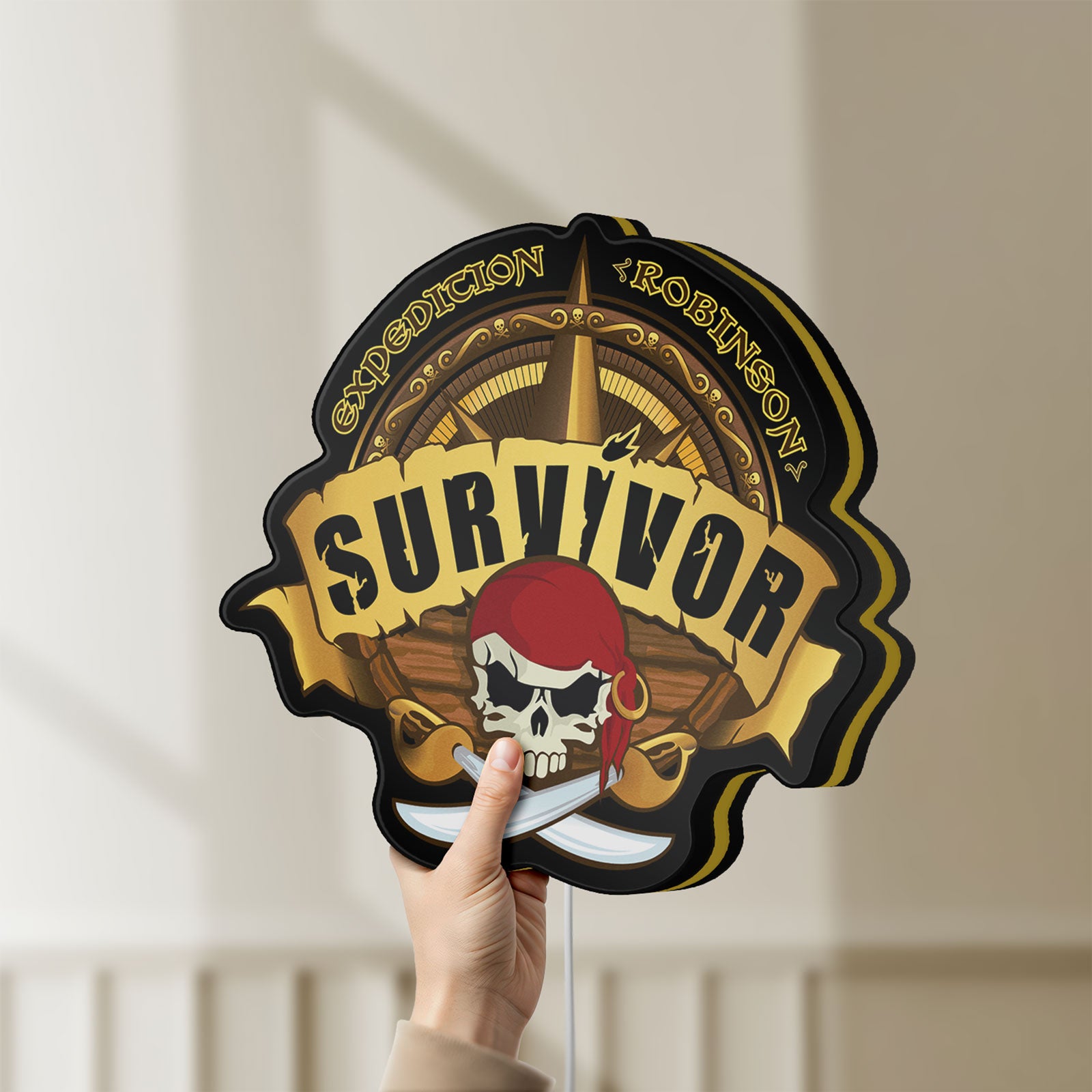 Unlit Expedition Robinson Survivor LED lightbox held by hand to show size and details