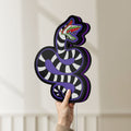 Unlit Beetlejuice Sandworm LED lightbox held by hand to show size and details