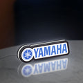 Yamaha LED lightbox standing on a desk from an angled side view with white glow