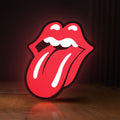 Front view of Rolling Stones LED lightbox sign glowing on a wooden desk