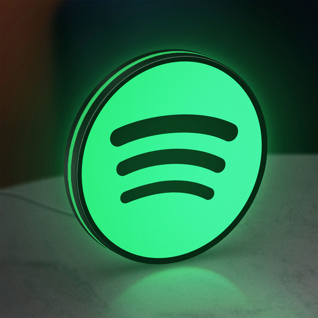 Spotify 2015 LED lightbox hanging on a wall with green glow