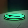 Spotify 2015 LED lightbox lying flat on a desk with green glow