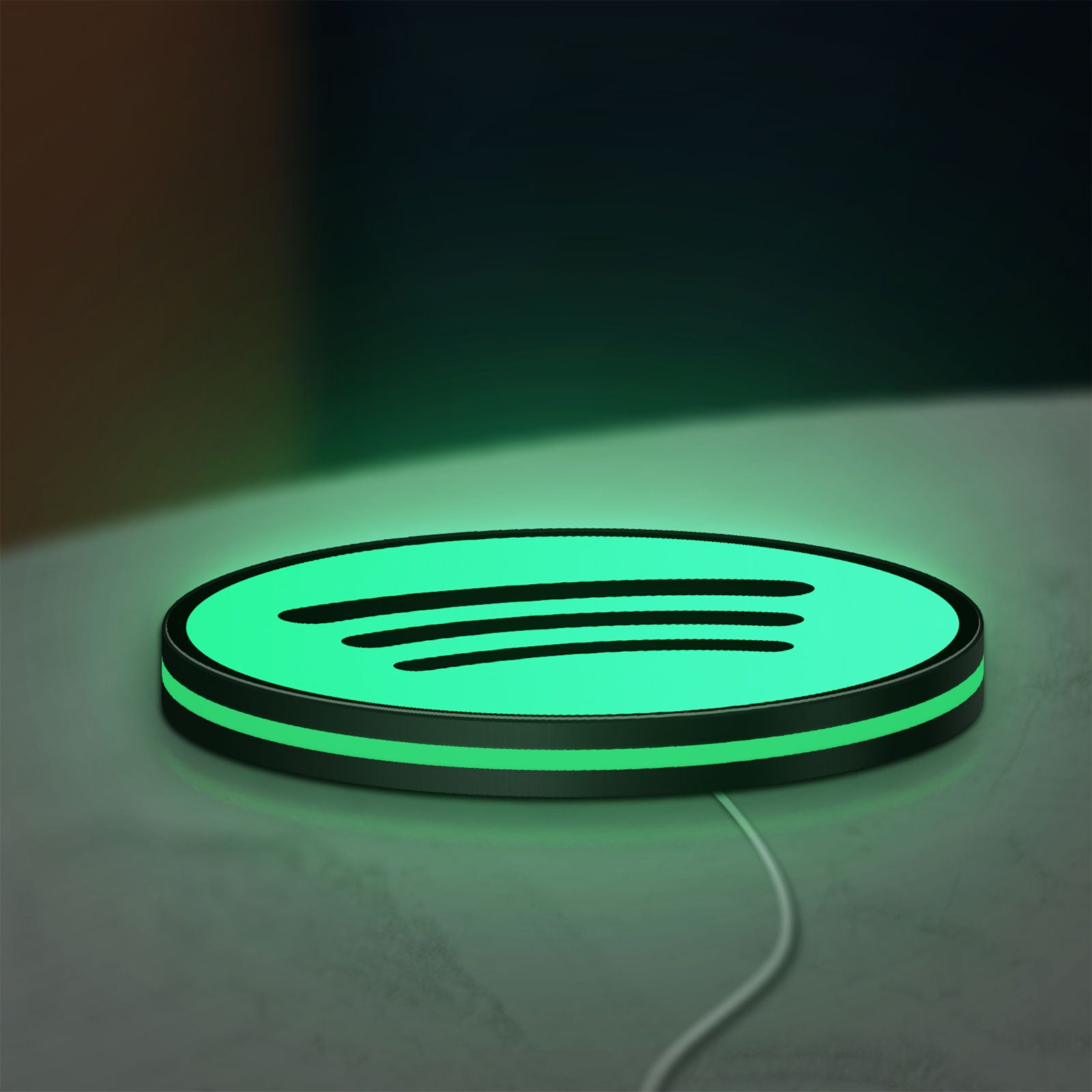 Spotify 2015 LED lightbox lying flat on a desk with green glow