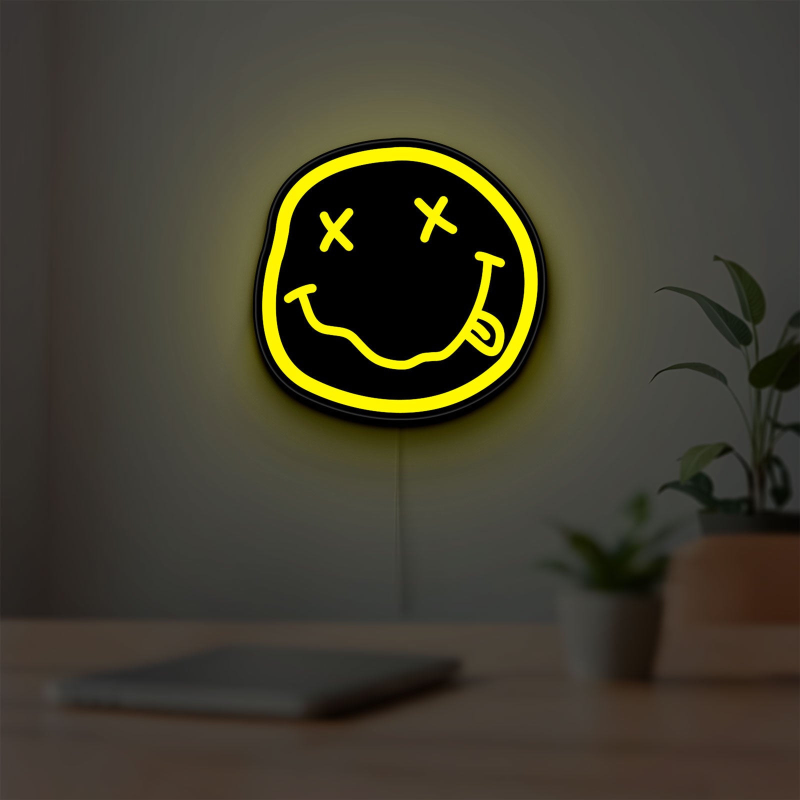 Nirvana LED lightbox hanging on a room wall with soft yellow light