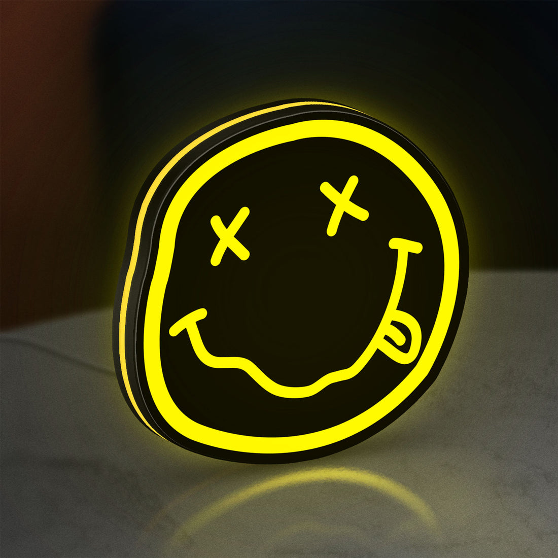 Nirvana LED lightbox hanging on a wall with yellow glow
