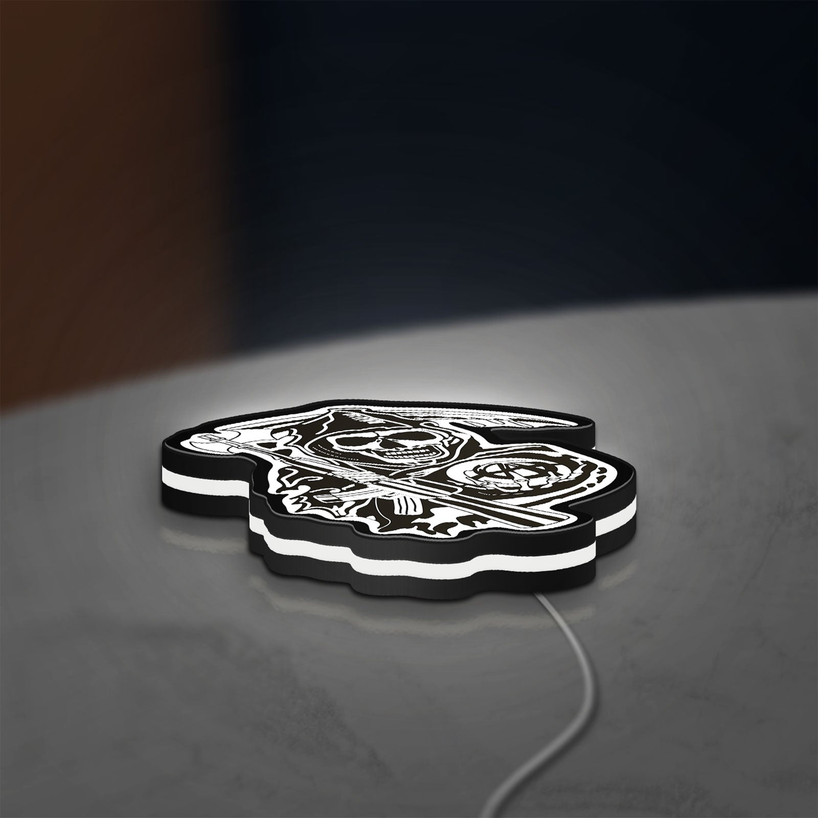 Sons of Anarchy LED lightbox lying flat on a desk with white glow
