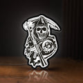 Front view of Sons of Anarchy LED lightbox sign glowing on a wooden desk
