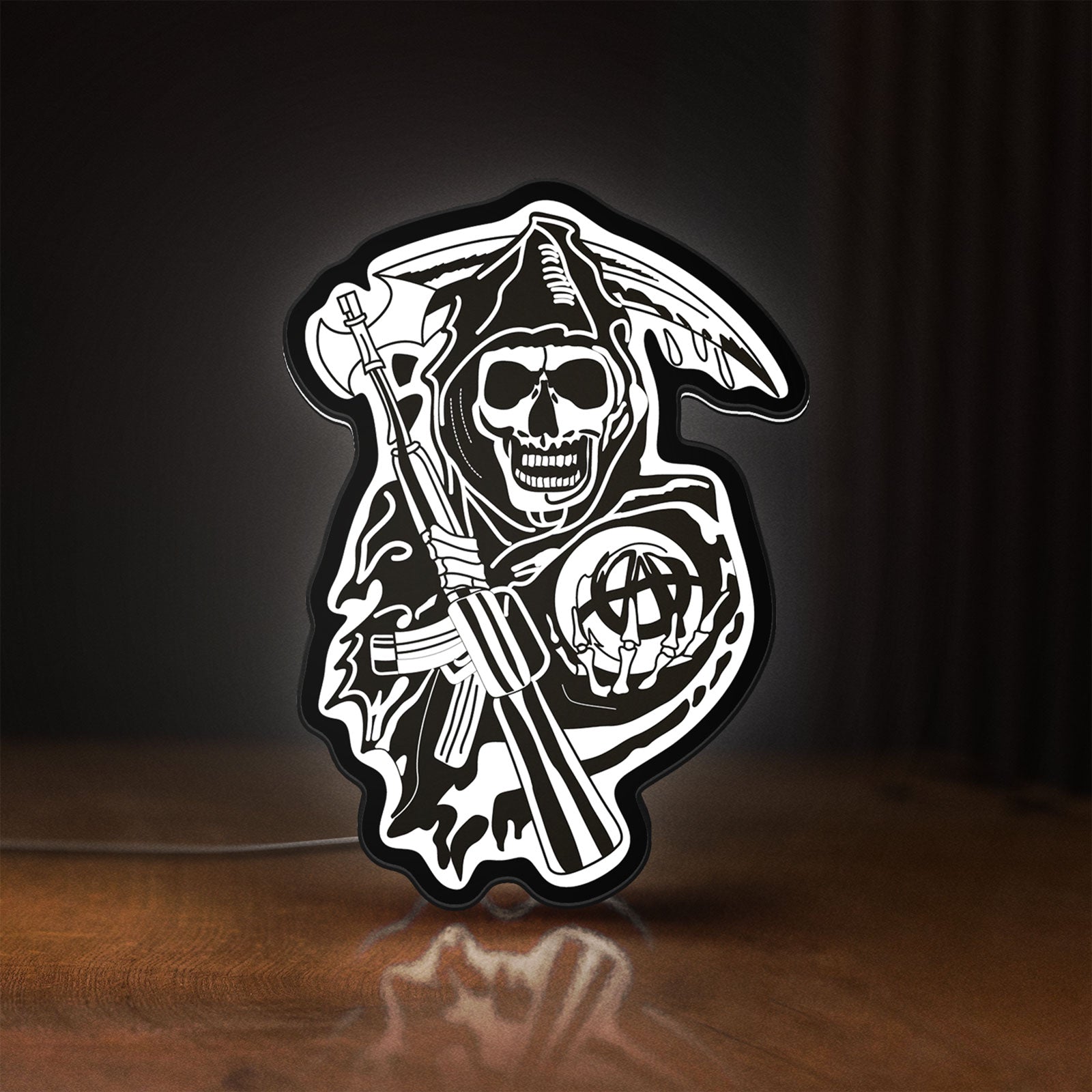 Front view of Sons of Anarchy LED lightbox sign glowing on a wooden desk