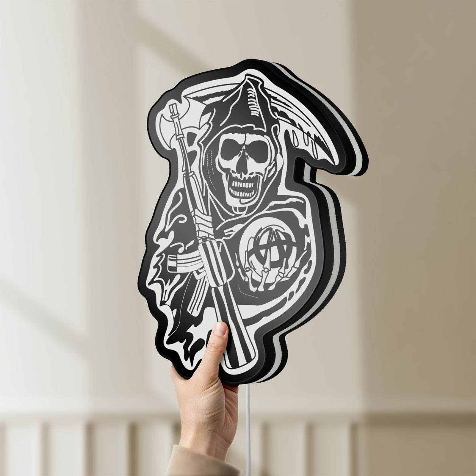 Unlit Sons of Anarchy LED lightbox held by hand to show size and details