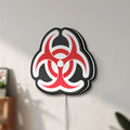 Unlit Biohazard LED lightbox mounted on a wall in daylight