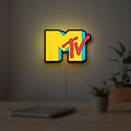 MTV Music Television LED lightbox hanging on a room wall with soft yellow light