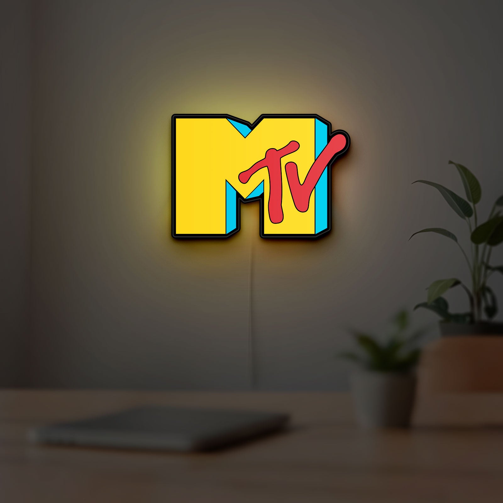 MTV Music Television LED lightbox hanging on a room wall with soft yellow light