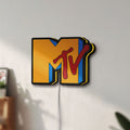Unlit MTV Music Television LED lightbox mounted on a wall in daylight