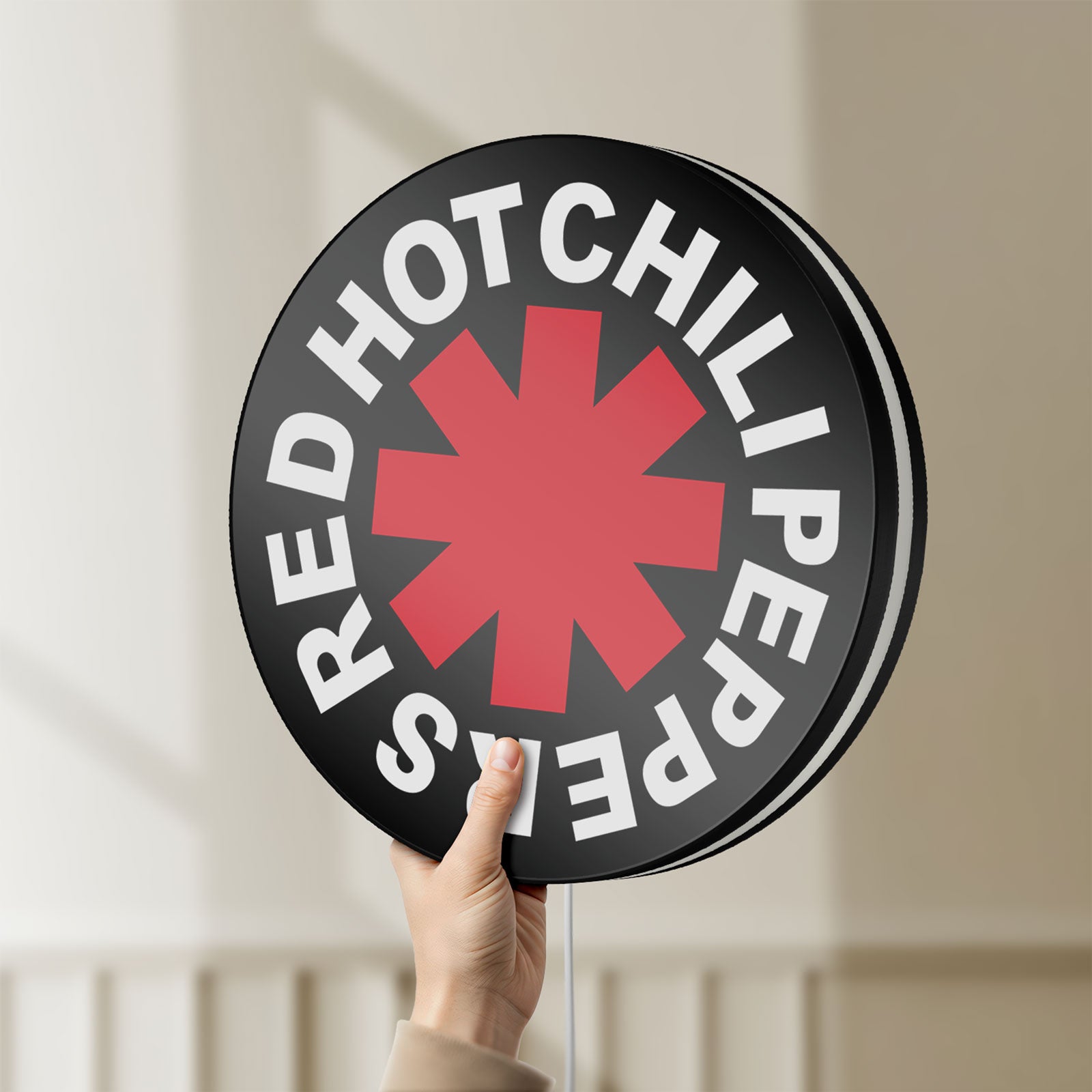 Unlit Red Hot Chili Peppers LED lightbox held by hand to show size and details