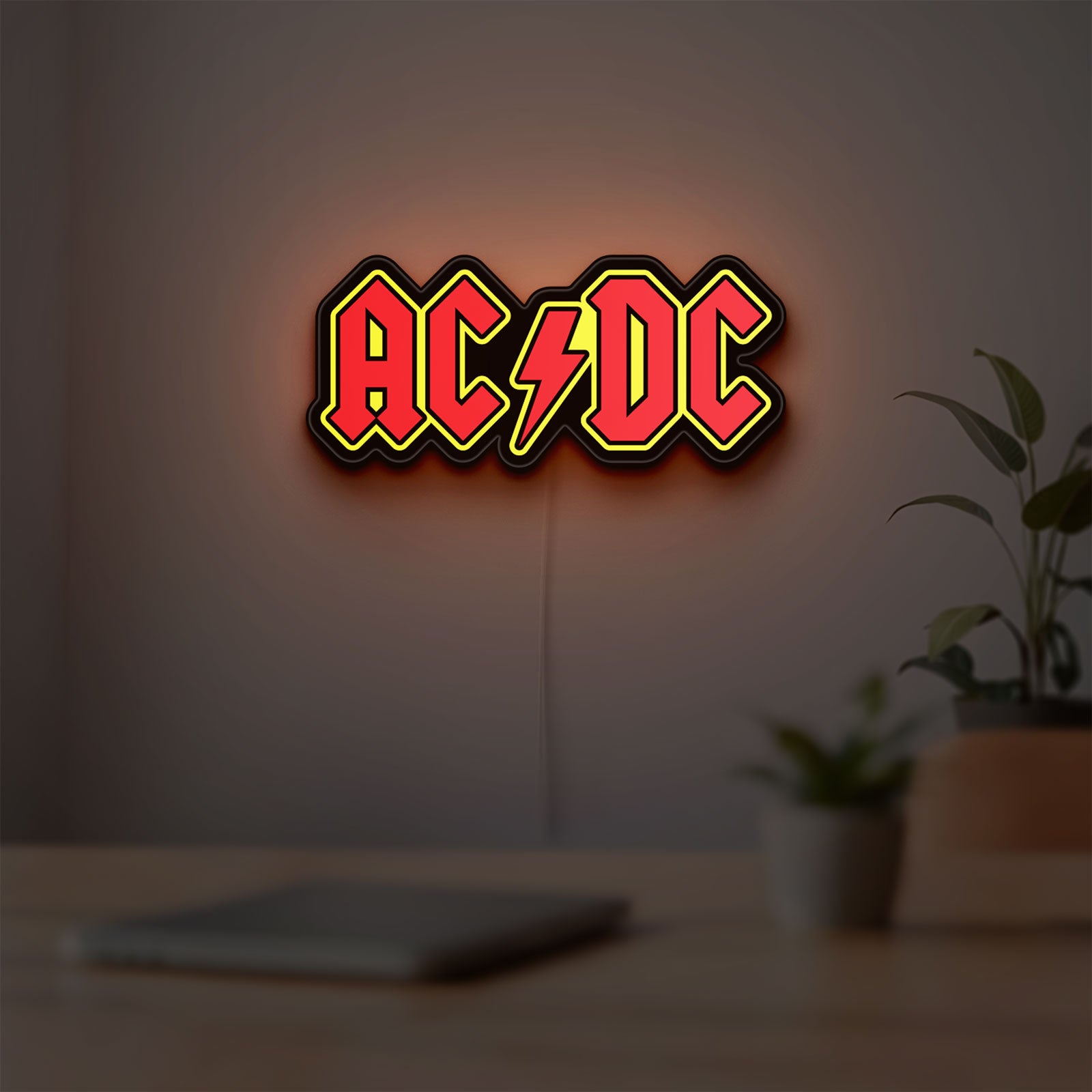 AC DC Red LED lightbox hanging on a room wall with soft yellow light