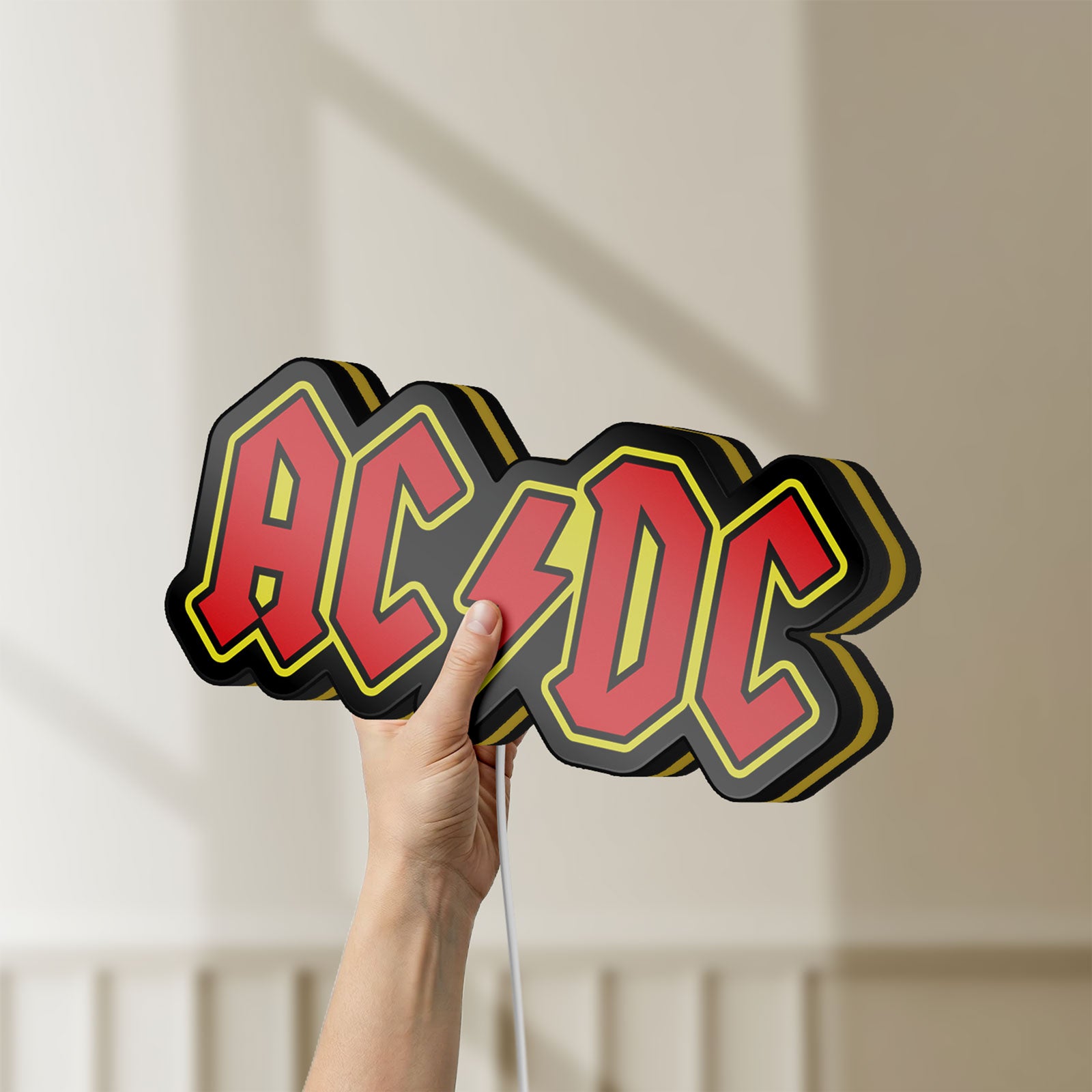 Unlit AC DC Red LED lightbox held by hand to show size and details