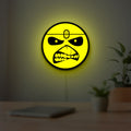 Iron Maiden Eddie LED lightbox hanging on a room wall with soft yellow light