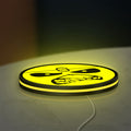 Iron Maiden Eddie LED lightbox lying flat on a desk with yellow glow