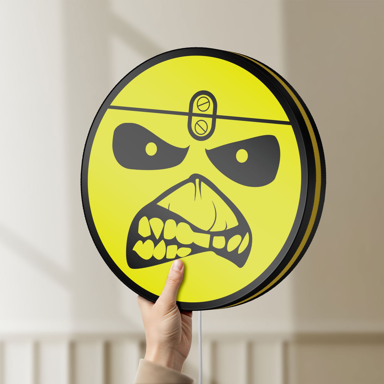 Unlit Iron Maiden Eddie LED lightbox held by hand to show size and details