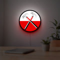 Pink Floyd Hammers LED lightbox hanging on a room wall with soft white light
