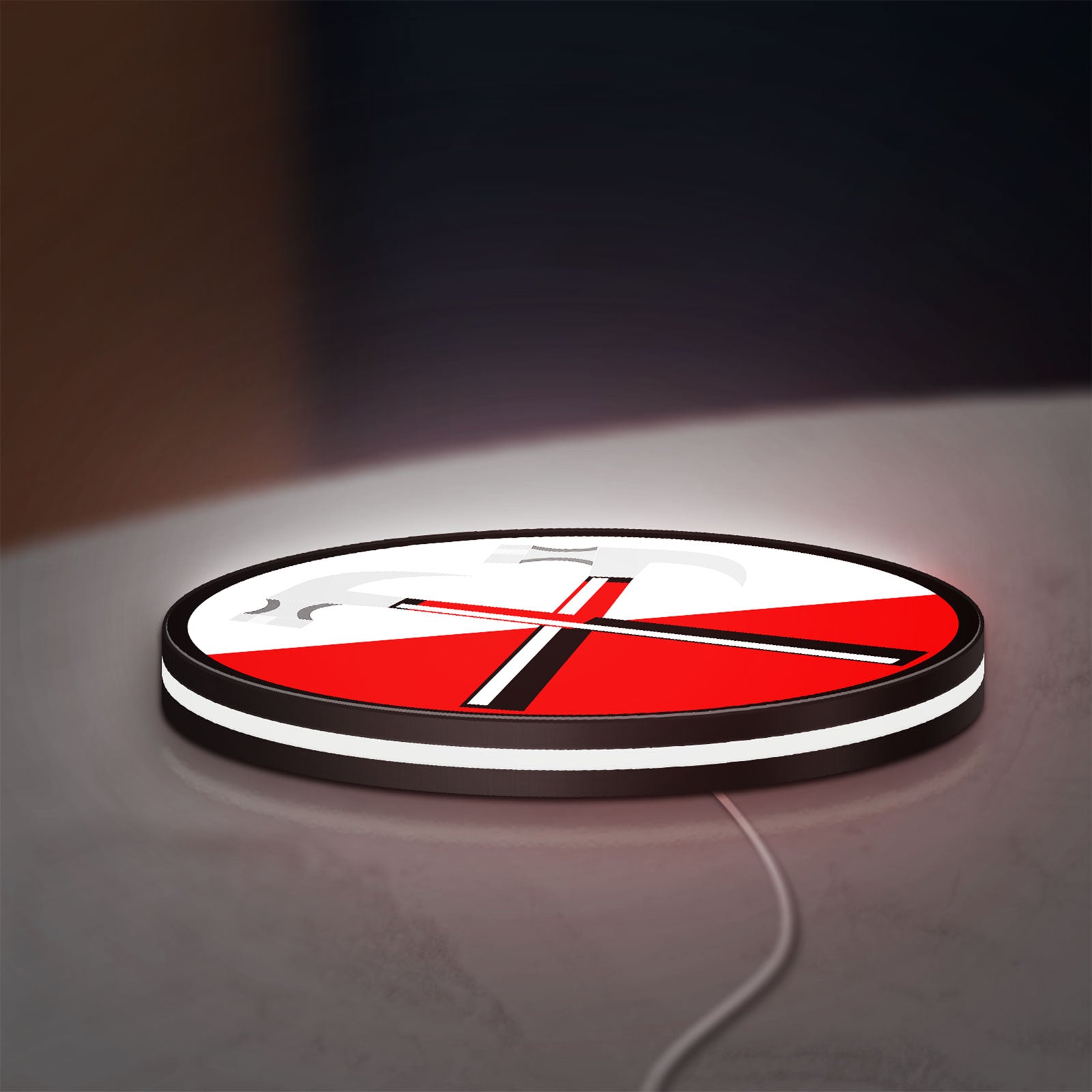 Pink Floyd Hammers LED lightbox lying flat on a desk with white glow