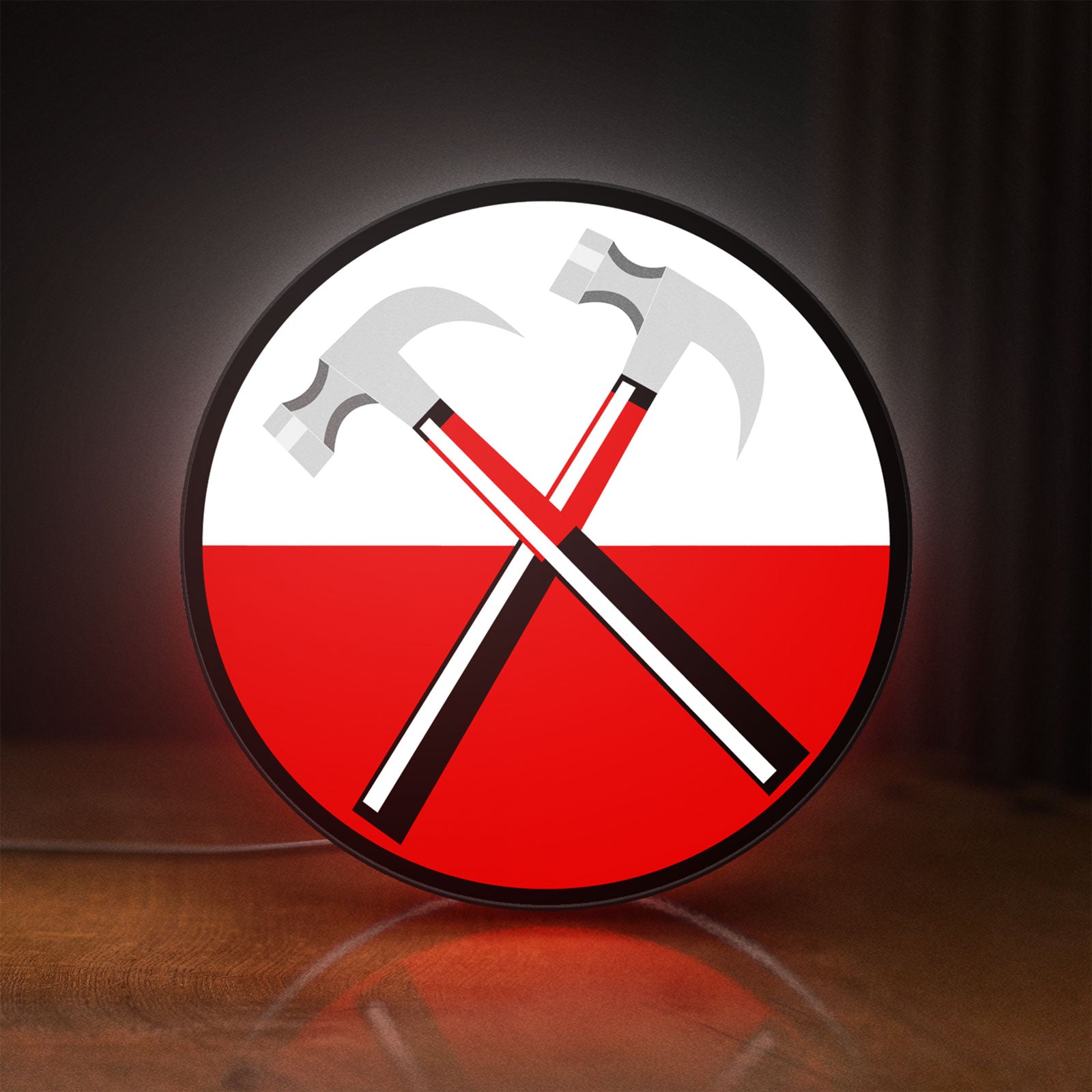 Front view of Pink Floyd Hammers LED lightbox sign glowing on a wooden desk