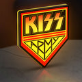 Kiss Army LED lightbox standing on a desk from an angled side view with yellow glow
