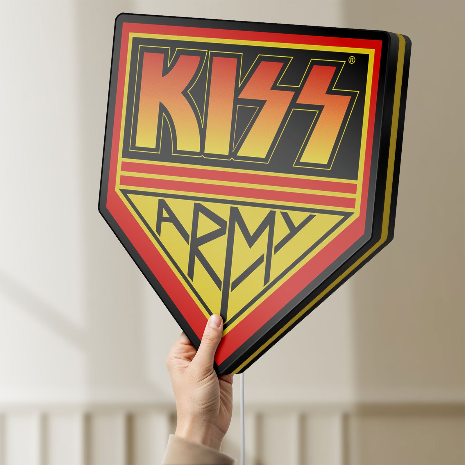 Unlit Kiss Army LED lightbox held by hand to show size and details